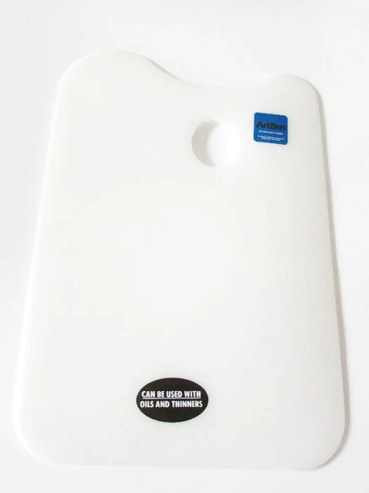 A white plastic palette with a round hole in the center, labeled 'Can't see with the naked eye' and 'ArtBin'.