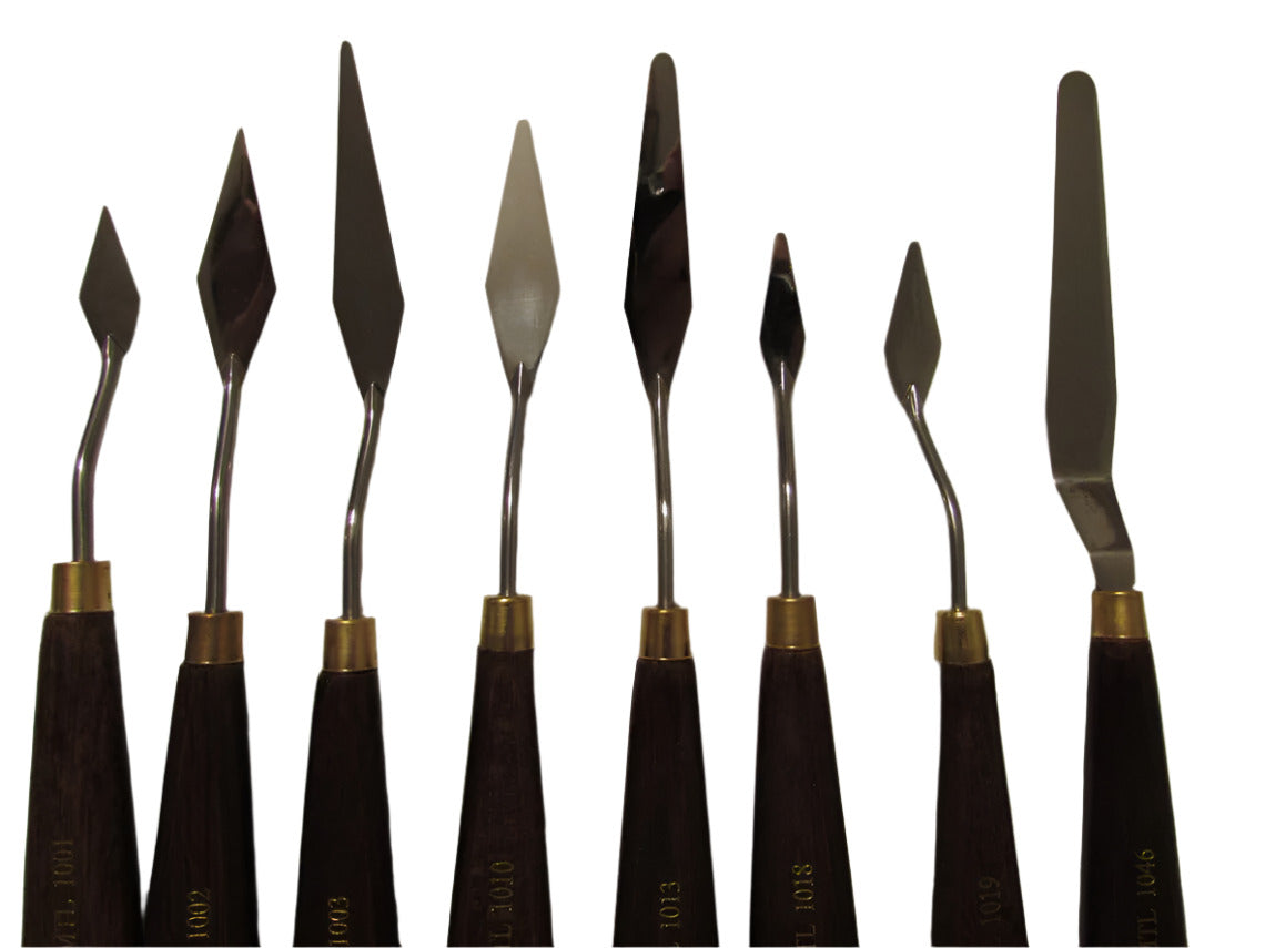 A collection of artist palette knives with wooden handles and metal blades, used for painting.