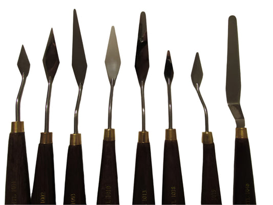 A collection of artist palette knives with wooden handles and metal blades, used for painting.